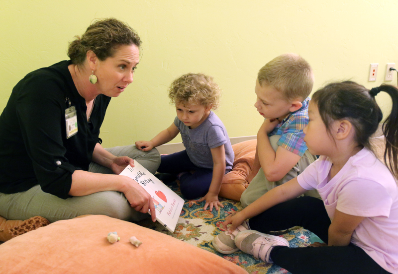 counselor reading to children